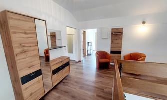 The entrance area is spacious with bright walls and a cozy atmosphere.