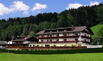 A cozy hotel in the midst of nature, surrounded by green woods. The terrace offers views of the picturesque landscape.