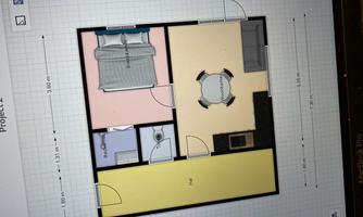 A basic representation of a room with different areas. There is a sleeping area, a kitchen, and a dining area.