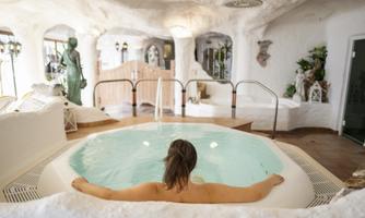 A relaxing wellness area with a whirlpool. The atmosphere is bright and inviting, perfect for relaxation and rejuvenation.