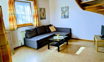 Living room of the holiday apartment Seeblick with couch