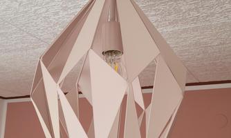A modern pendant light in geometric design. The lamp has a delicate pink color and hangs from a white ceiling.
