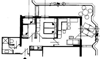 A floor plan drawing of an apartment with several rooms. The rooms are clearly arranged, including living area, kitchen, and bedroom.