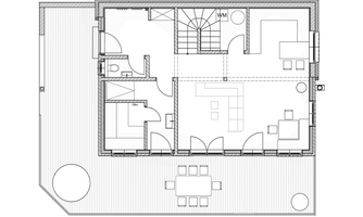 An architectural floor plan of a house with several rooms. The plan shows areas such as living room, bedroom, and dining area.