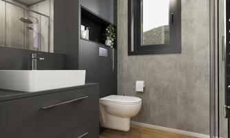 A modern bathroom with gray walls and wooden flooring. It has a shower, a sink, and a toilet.