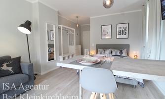 A stylish living space with modern furnishings. There is a cozy seating area and a dining space, ideal for relaxing moments.