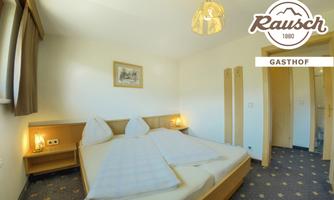 A cozy guest room with a double bed, warm lighting, and a beautiful, simple design. The walls are painted in gentle shades, and the room offers pleasant tranquility.