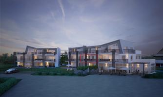 Modern residential buildings at dusk with balconies and a spacious parking lot. The architecture is appealing and contemporary.