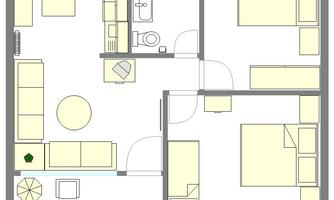 A simple apartment layout with a living room, a kitchen, and two bedrooms. The design also shows a bathroom and a small dining area.