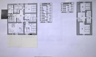 A floor plan of a house with two floors. The legendary measurements and designations are listed on the right.
