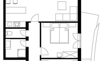 A floor plan of a house with several rooms. The drawing depicts an open living area, two bedrooms, and a kitchen.