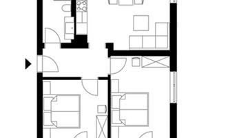 A simple floor plan of an apartment with two bedrooms, a living room, and a kitchen. The plan also includes a dining area and shows the layout of the rooms.