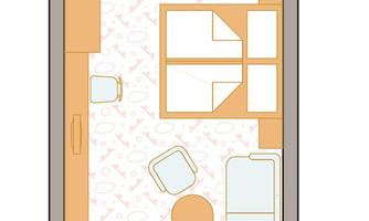 A simple floor plan drawing of a room. The plan shows a combination of living and sleeping areas with furniture arrangements.