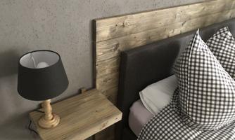 A modern bedroom with a wooden headboard and checkered pillows. Next to the bed is a nightstand with a lamp.
