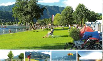 A beautiful lake surrounded by green grass and trees. People are enjoying the day swimming, relaxing, and biking.