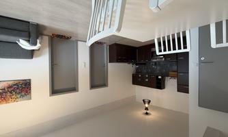 View into the fully equipped kitchen as well as the two bedrooms