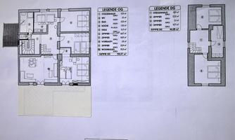 A floor plan of a house with two stories. The plans show the arrangement of the rooms and their sizes.