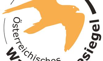 A logo with an orange bird and the text "Austrian Hiking Quality Seal". It stands for quality in the hiking offer in Austria.