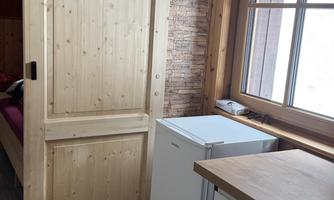 The shower room additionally includes a privately usable refrigerator and kettle/coffee machine.