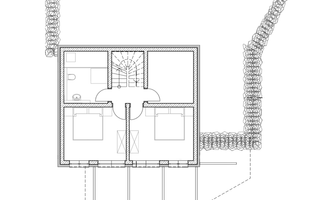 A floor plan of a house with two bedrooms, one bathroom, and a central room. The plan also shows an surrounding structure.
