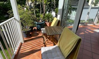 A cozy balcony with two chairs and a table - perfect for an espresso in the morning.