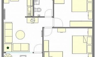 A floor plan sketch of an apartment with two bedrooms, a bathroom, and a living area. The kitchen is open-plan and equipped with a dining table as well as living room furniture.