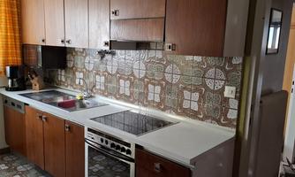 fully equipped, purposefully furnished kitchen with connected pantry, refrigerator with freezer compartment