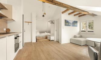 A modern and bright apartment with an open living area. The rooms are well-designed and provide a cozy atmosphere.