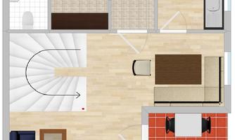 A floor plan of a house with an open living area, a kitchen, and a dining area. There is also a staircase leading to an upper floor.