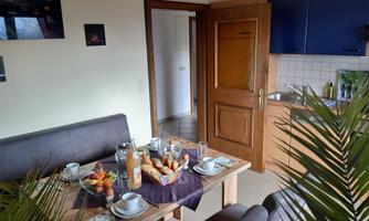 A cozy dining area in the living kitchen of vacation apartment Phlox