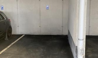 A parking space marked A5. The wall is gray and there is a pipe on the right side.