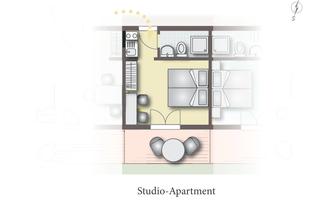 A floor plan of a studio apartment. The rooms are clearly defined with kitchen, living room, and sleeping area.