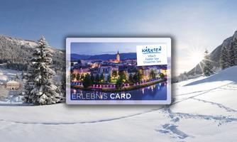 An experience card lies in the snow with a winter landscape in the background. The sun is shining behind the mountains.