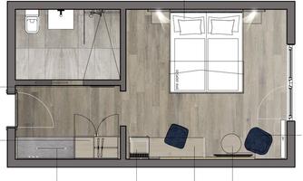 A floor plan representation of a room with a bedroom and a bathroom. The room has two beds, a seating area, and a kitchenette.