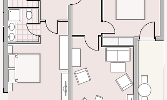 A floor plan of an apartment with two bedrooms, a living room, and a kitchen. The plan also shows balconies to the south.