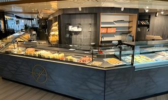 The modern sales counter of the patisserie, offering a wide variety of homemade specialties.