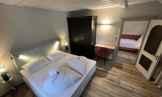 The ideal room type for families with one child or for 3 friends with single and double rooms. Allergy-friendly with wood laminate floors.