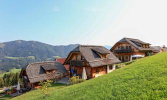 A beautiful mountain village with traditional wooden houses. The view of the surrounding mountains is breathtaking.
