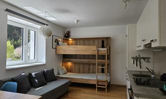 The wall-mounted box bed can be folded out as needed for one or two people. Mainly suitable for children.