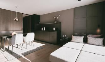 A modern living room with a bright, minimalist design. There is a small dining area and comfortable seating.