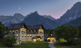 A picturesque house in the mountains at sunset. The windows are illuminated and the moon is visible in the sky.