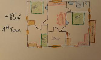 A floor plan of an apartment with an area of about 85 m². It shows various rooms such as a bedroom, kitchen, living room, and a balcony.
