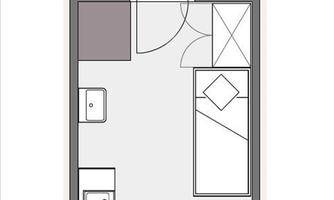 A floor plan of a small apartment. The apartment contains a bedroom, a bathroom, and a kitchenette.