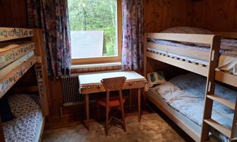Children's room with 2 bunk beds and a small sink
