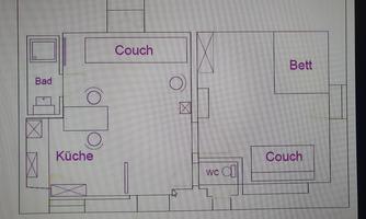 A floor plan drawing of an apartment. The rooms are labeled with "Kitchen," "Couch," "Bed," and "Bathroom."