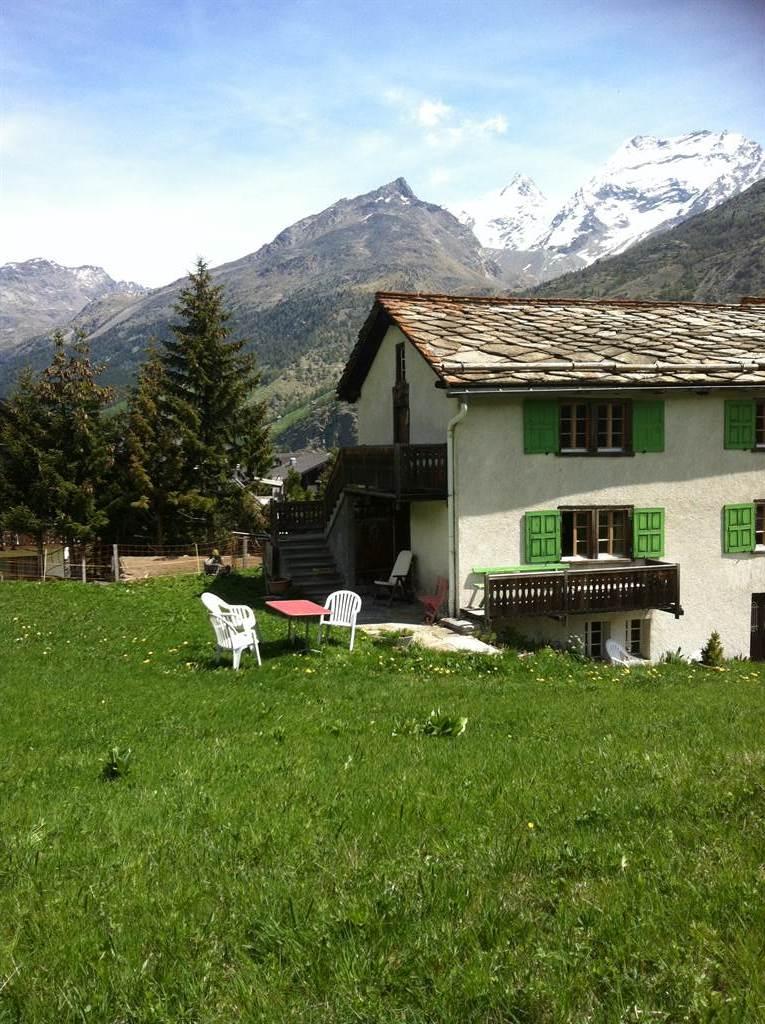 Hausbild Sommer mit grosser Wiese Hausbild Sommer mit grosser Wiese