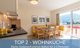 Modern living kitchen with dining table and balcony. Bright and welcoming, ideal for 2-5 people.