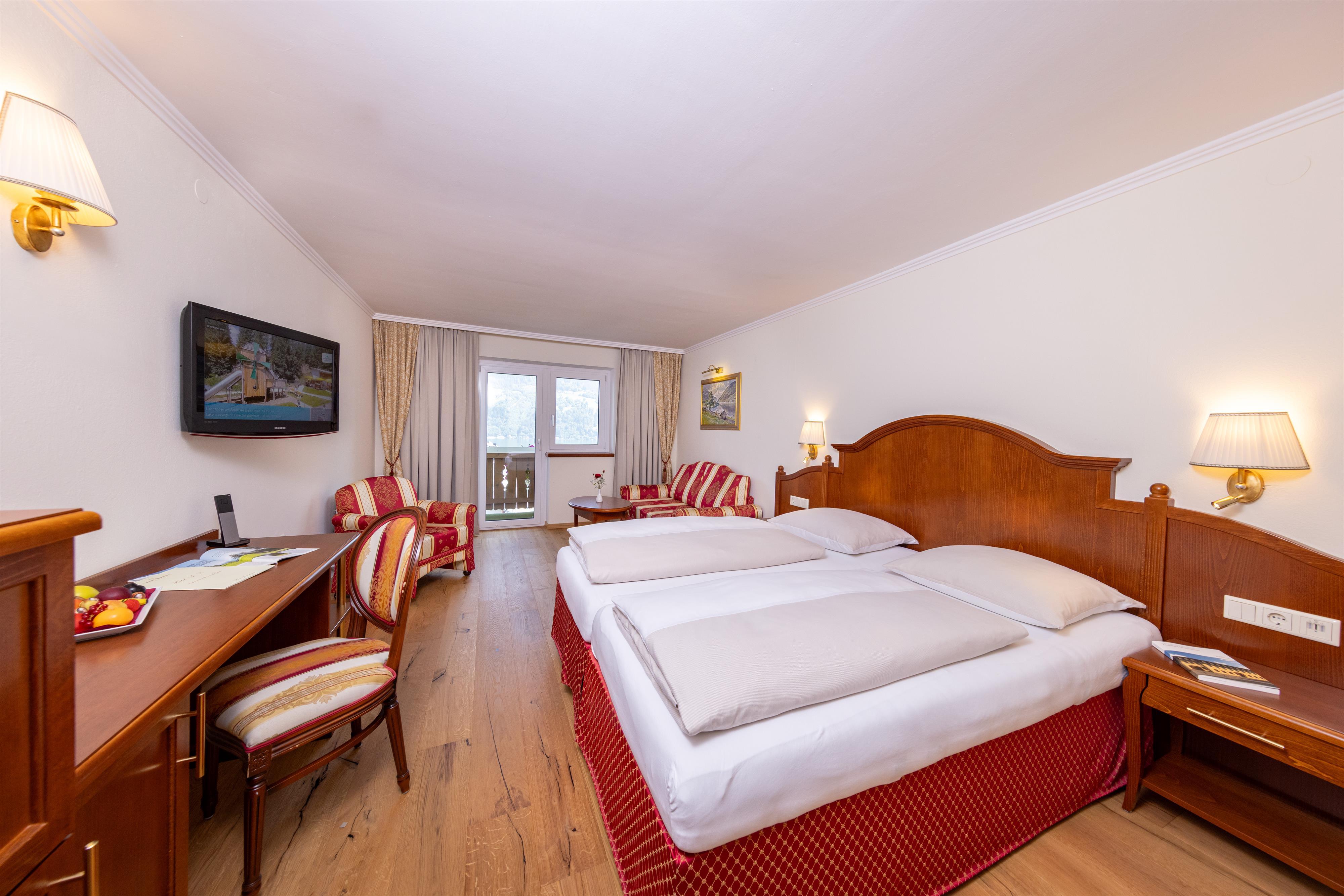 Junior Suite with balcony overlooking the town and lake