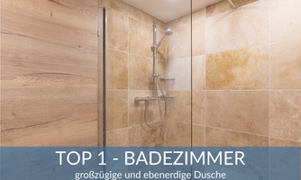A modern bathroom with a spacious, walk-in shower. The walls are in warm earth tones.