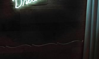 A neon-colored luminous sign with the inscription "Dream big" on a dark wall. The atmosphere is modern and inspiring.
